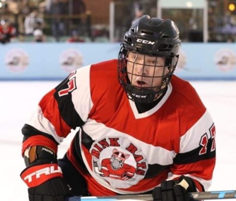 Paul Warriner skating in a Rink Rats jersey